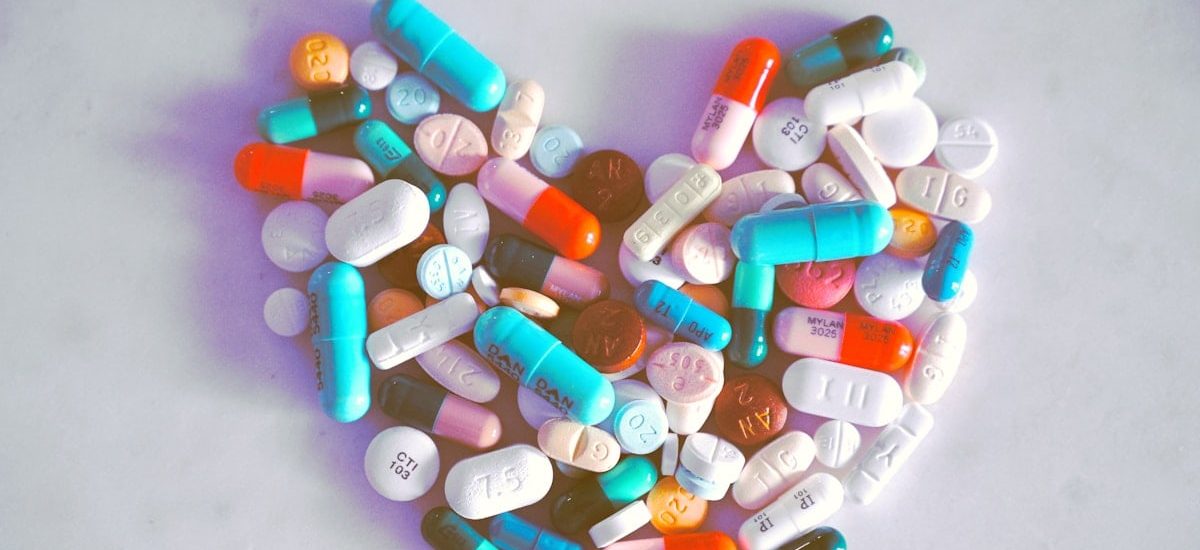 A compiled bunch of pills shaped into a heart, because art. 