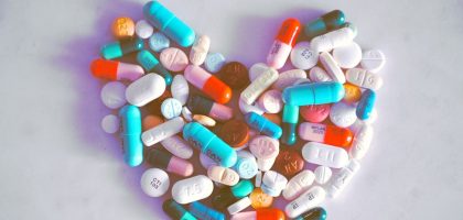 A compiled bunch of pills shaped into a heart, because art. 