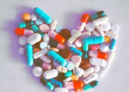 A compiled bunch of pills shaped into a heart, because art. 